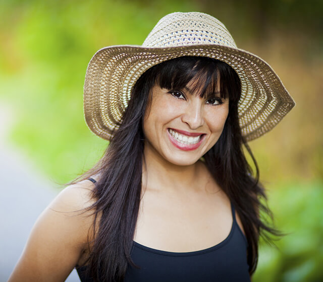 Woman in a sun hat smiling