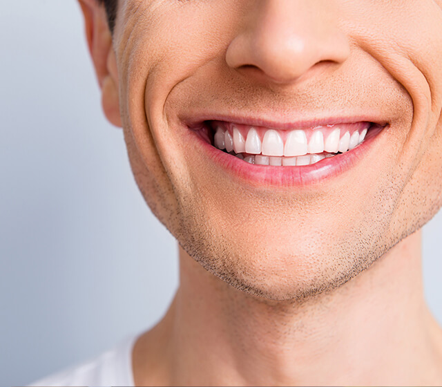 Close up of a man's straight smile