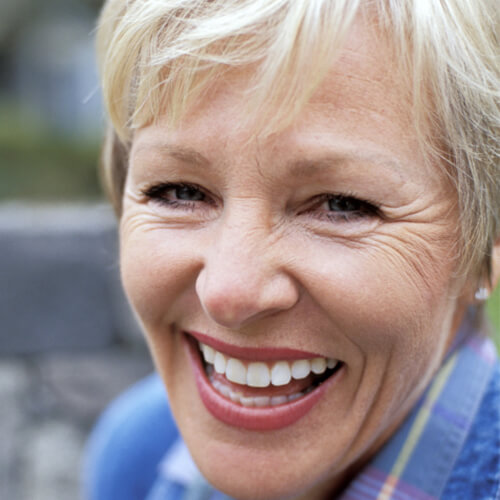 Close up of an older woman with a big smile
